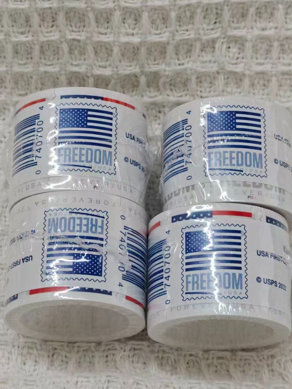 20 rolls of U.S. Postal Service stamps, totaling 2,000 brand new stamps.